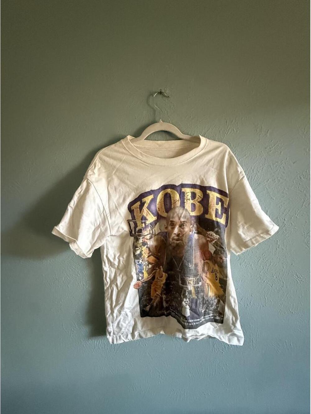 Kobe Bryant tee with 'KOBE' text and basketball player image #basketball #lakers